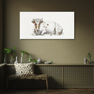 A calm cow in the meadow Glass art print