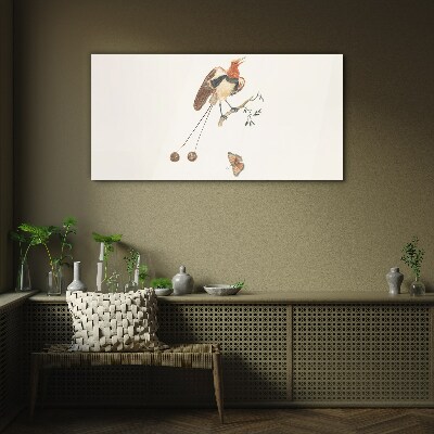 A bird on a branch with fruit Wall art on glass
