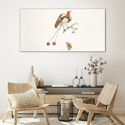 A bird on a branch with fruit Wall art on glass