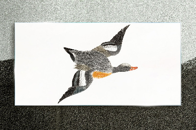 Flying goose in the colors of nature Glass art print