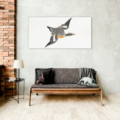 Flying goose in the colors of nature Glass art print
