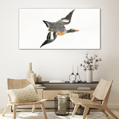 Flying goose in the colors of nature Glass art print