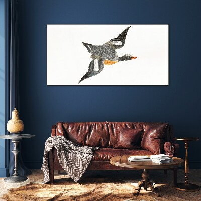 Flying goose in the colors of nature Glass art print