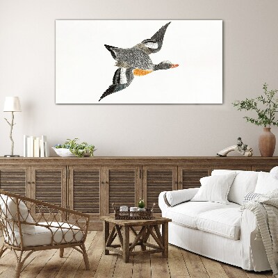Flying goose in the colors of nature Glass art print