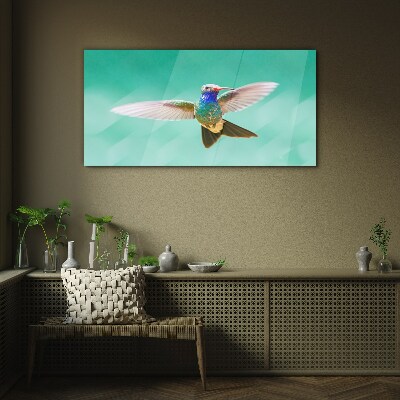 Hummingbird in blue background Wall art on glass