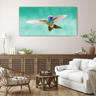 Hummingbird in blue background Wall art on glass