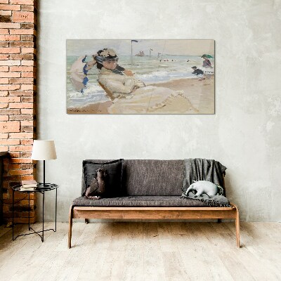 Woman on the beach with an umbrella Wall art on glass