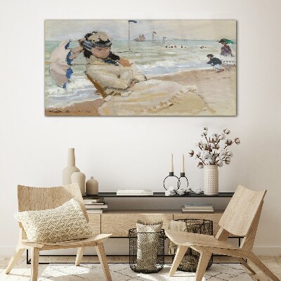 Woman on the beach with an umbrella Wall art on glass