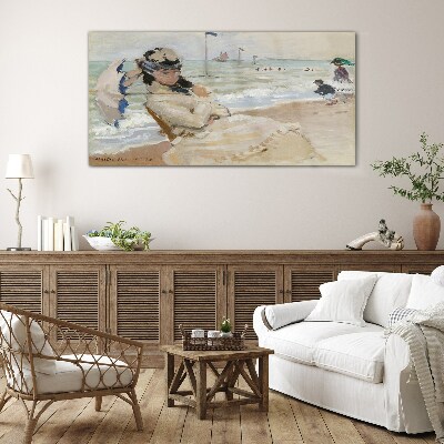 Woman on the beach with an umbrella Wall art on glass