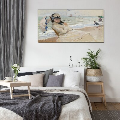 Woman on the beach with an umbrella Wall art on glass