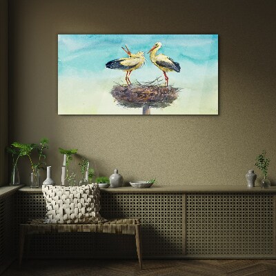 Storks on a nest in the blue Glass art print