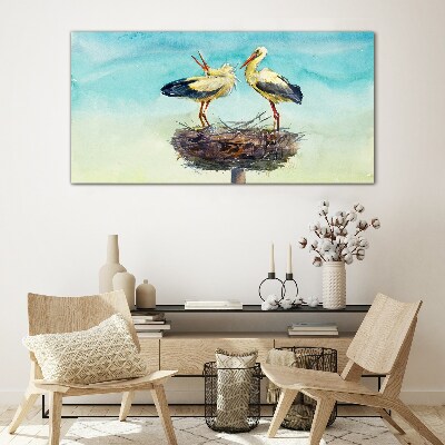 Storks on a nest in the blue Glass art print