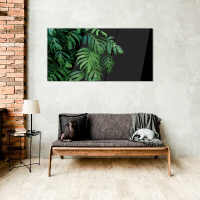 Green leaves on a black background Glass art print