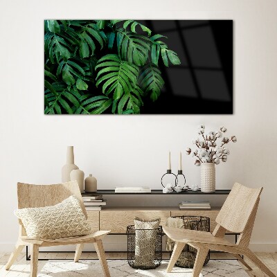 Green leaves on a black background Glass art print