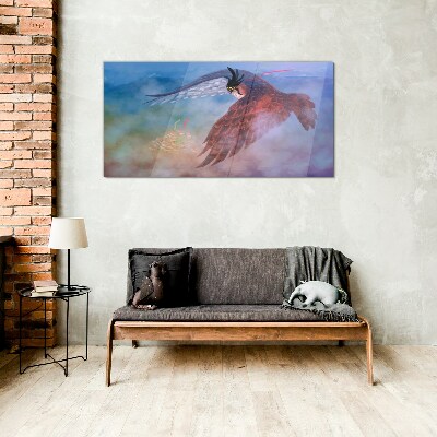Flight of a bird of prey in the clouds Glass art print