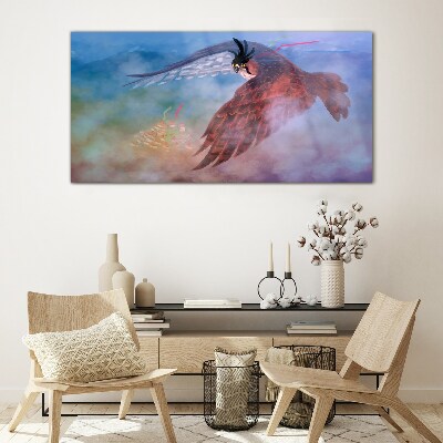Flight of a bird of prey in the clouds Glass art print