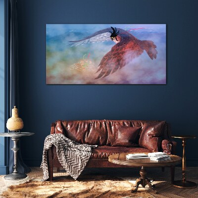 Flight of a bird of prey in the clouds Glass art print