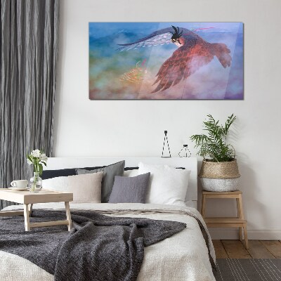 Flight of a bird of prey in the clouds Glass art print