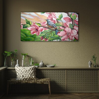 A bird against a background of spring flowers Wall art on glass