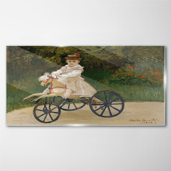Child on a ride-on Glass art print