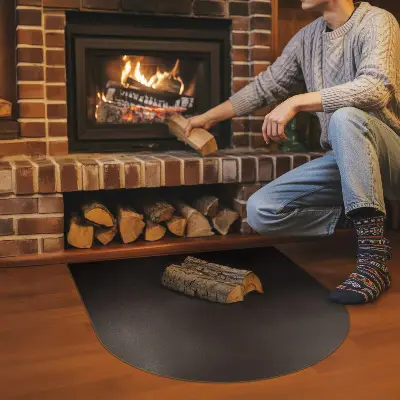 Semi-oval black steel fireplace hearth pad