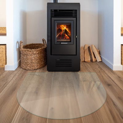 Semi-oval frosted glass hearth for log burner