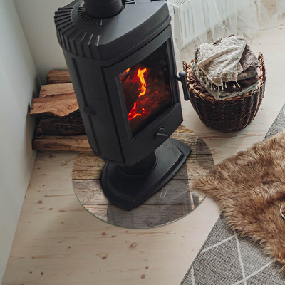 Glass hearth for stove round Wooden board in arrangement