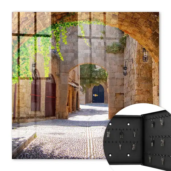 Key box for home A stone street with architecture and greenery