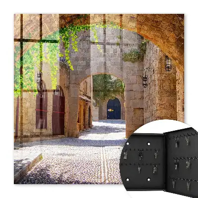 Key box for home A stone street with architecture and greenery