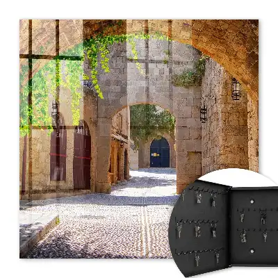Key box for home A stone street with architecture and greenery