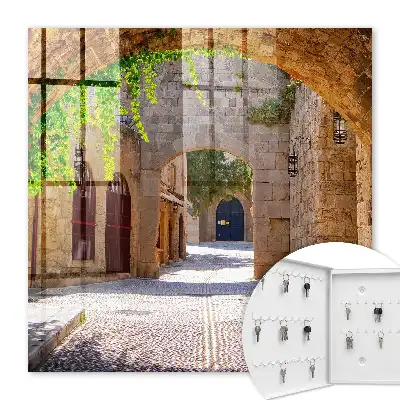 Key box for home A stone street with architecture and greenery