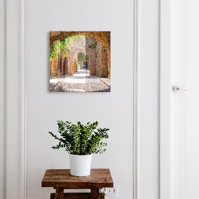 Key box for home A stone street with architecture and greenery