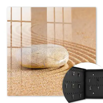 Wall mounted key box Stone on the sand, gentle waves