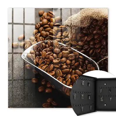 Key cabinet Coffee beans in a metal ladle