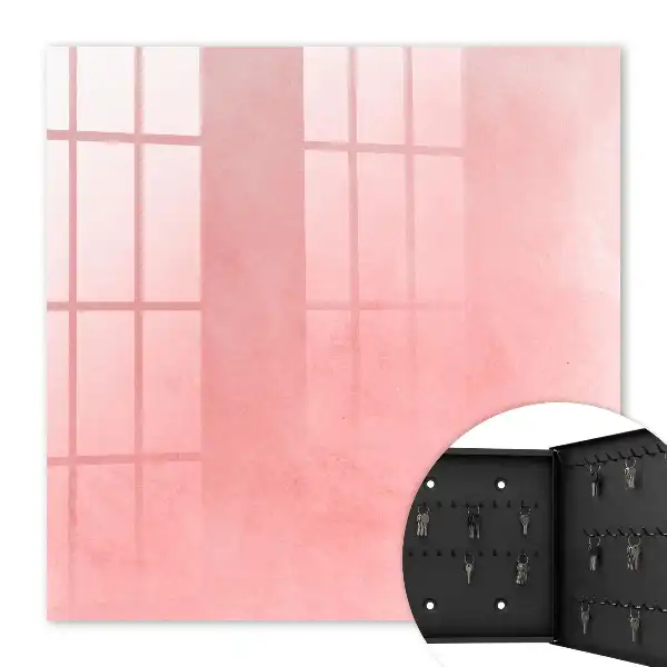 Wall mounted key cabinet Pink background with a subtle pattern