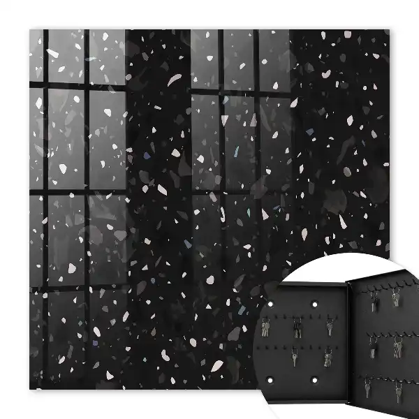Wall mounted key cabinet Black terrazzo in the background