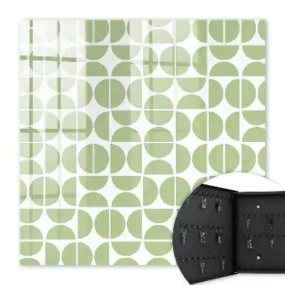Wall mounted key cabinet Green geometry on white background