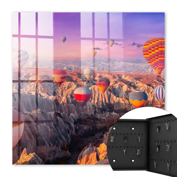 Wall mounted key cabinet Balloons in the air over a rocky valley