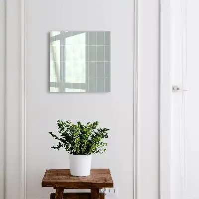 Wall mounted key cabinet Blue tiles in muted tones