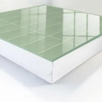 Wall mounted key box Green tiles in a symmetrical arrangement