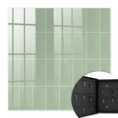 Wall mounted key box Green tiles in a symmetrical arrangement