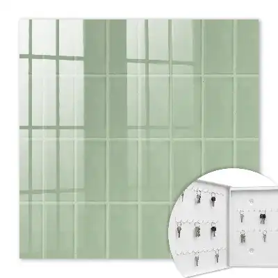 Wall mounted key box Green tiles in a symmetrical arrangement