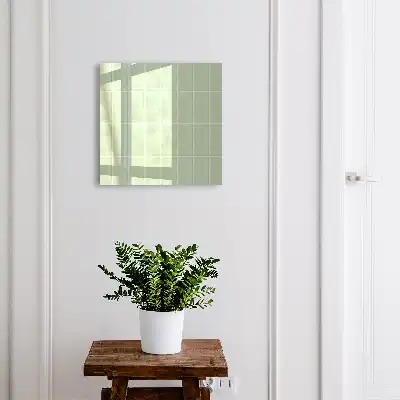 Wall mounted key box Green tiles in a symmetrical arrangement
