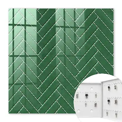 Wall mounted key cabinet The green herringbone of a space of elegance