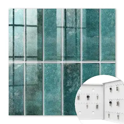 Wall mounted key cabinet Turquoise tiles enrich the space