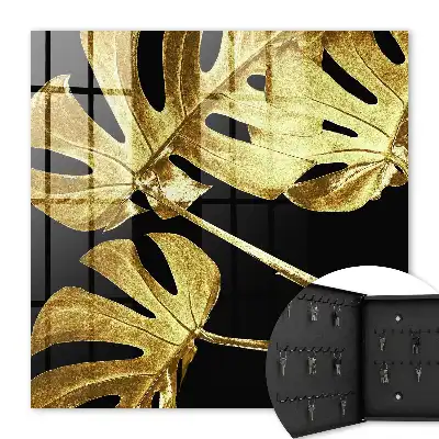 Key cabinet Monstera leaves in black background