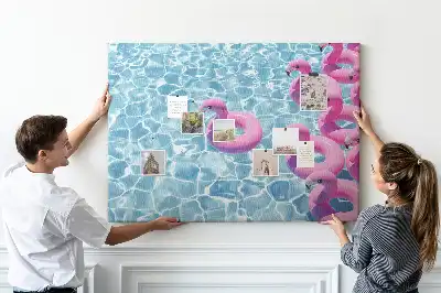 Cork memo board featuring dandelions and flamingos