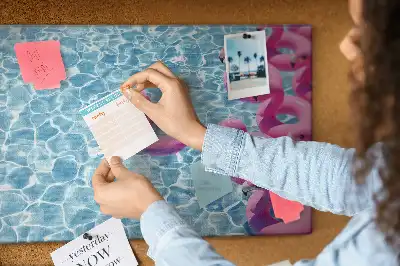 Cork memo board featuring dandelions and flamingos